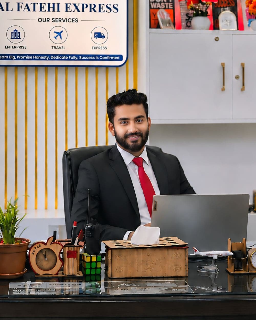 MD Nayem Chowdhury, Founder and Managing Director of Al Fatehi Express, at his desk beneath the Al Fatehi Express signboard